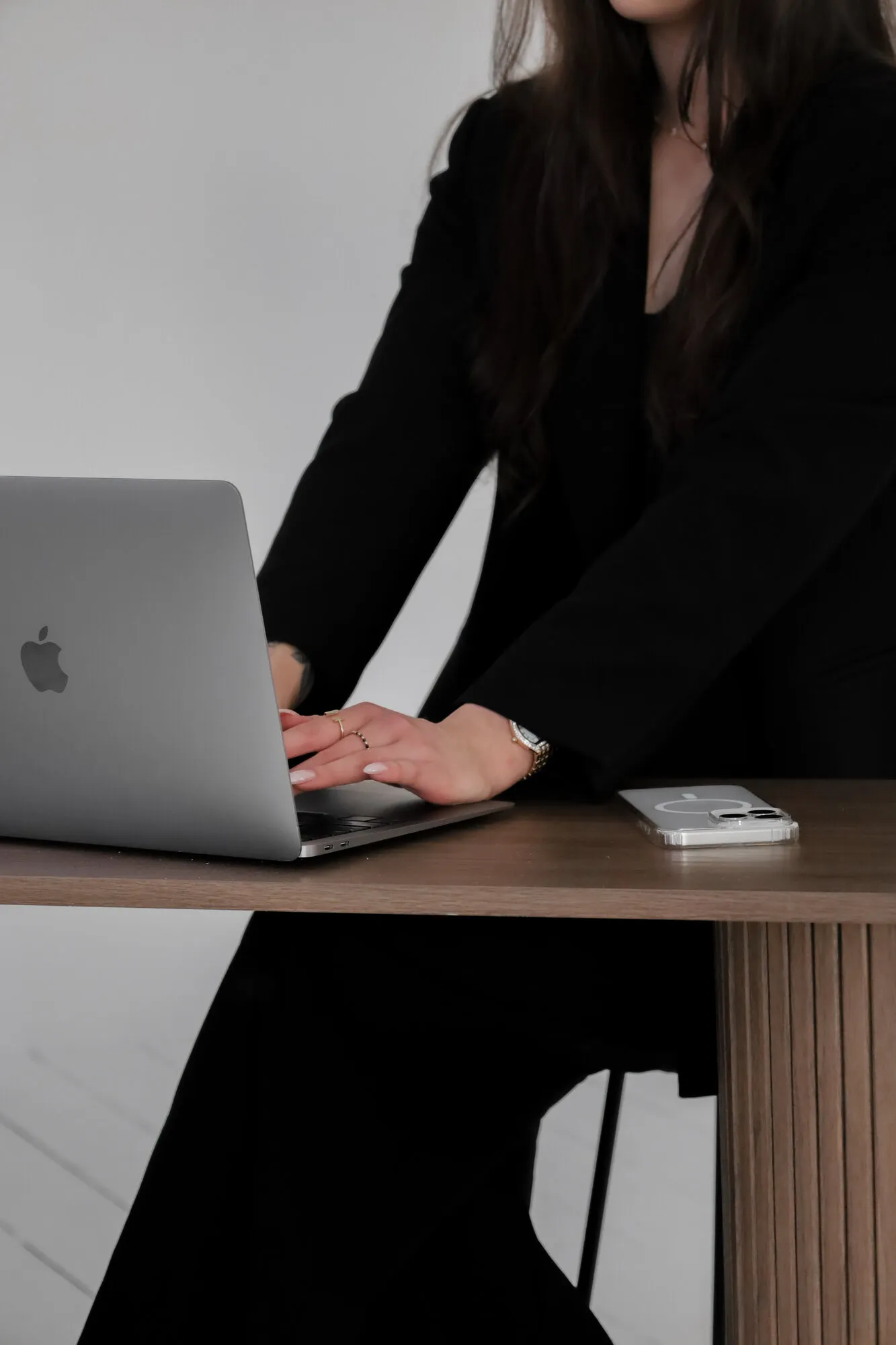 Caitlin working at her laptop