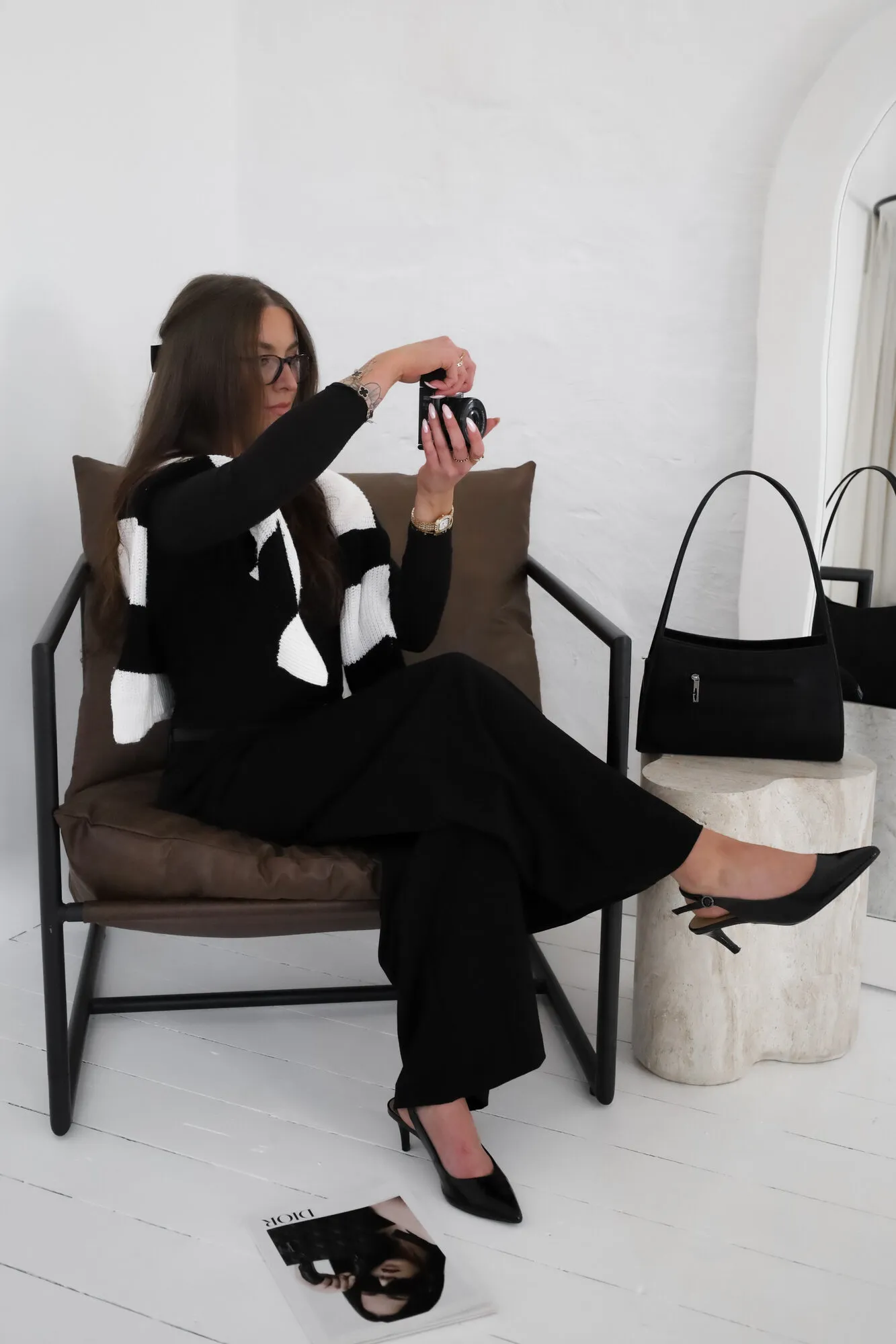 Caitlin photographing a set in the studio